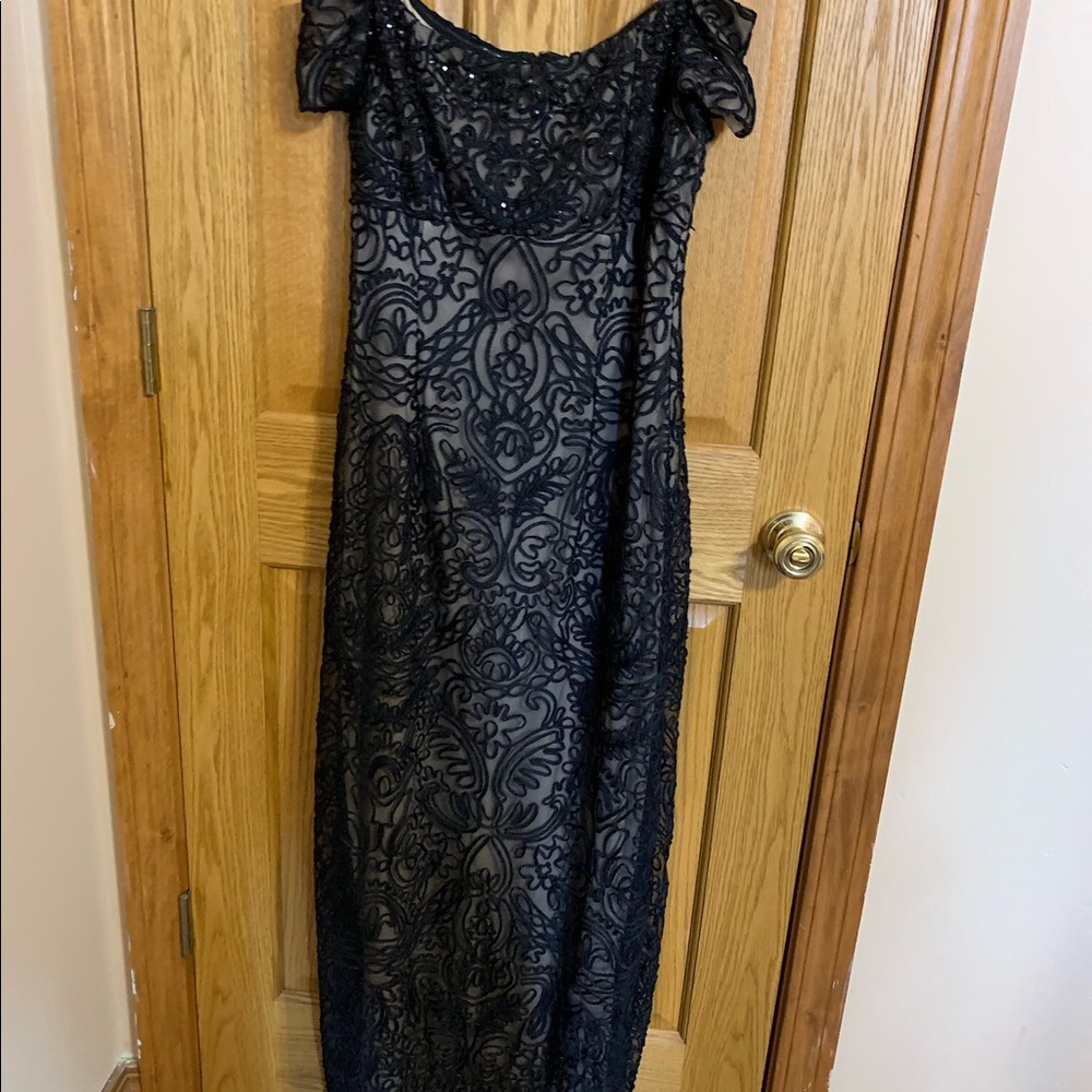 Black detailed evening gown .